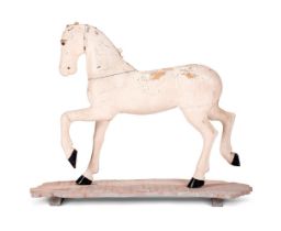 A SWEDISH CARVED AND PAINTED PINE MODEL OF A HORSE, LATE 19TH CENTURY
