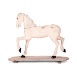 A SWEDISH CARVED AND PAINTED PINE MODEL OF A HORSE, LATE 19TH CENTURY