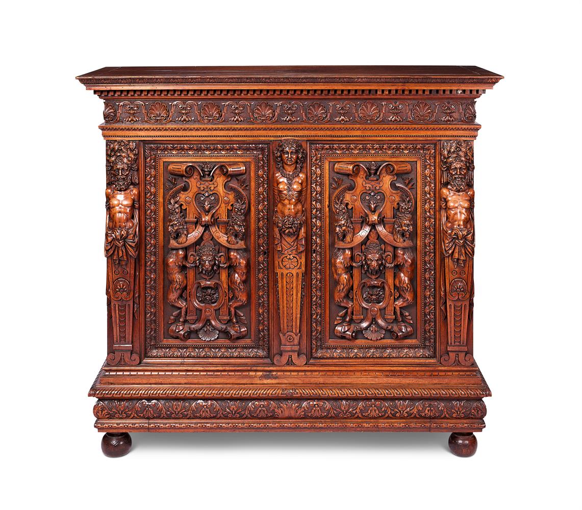 A RENAISSANCE REVIVAL CARVED WALNUT SIDE CABINETITALIAN, IN THE MANNER OF LUIGI FRULLINI, CIRCA 1880