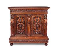 A RENAISSANCE REVIVAL CARVED WALNUT SIDE CABINETITALIAN, IN THE MANNER OF LUIGI FRULLINI, CIRCA 1880