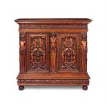 A RENAISSANCE REVIVAL CARVED WALNUT SIDE CABINETITALIAN, IN THE MANNER OF LUIGI FRULLINI, CIRCA 1880