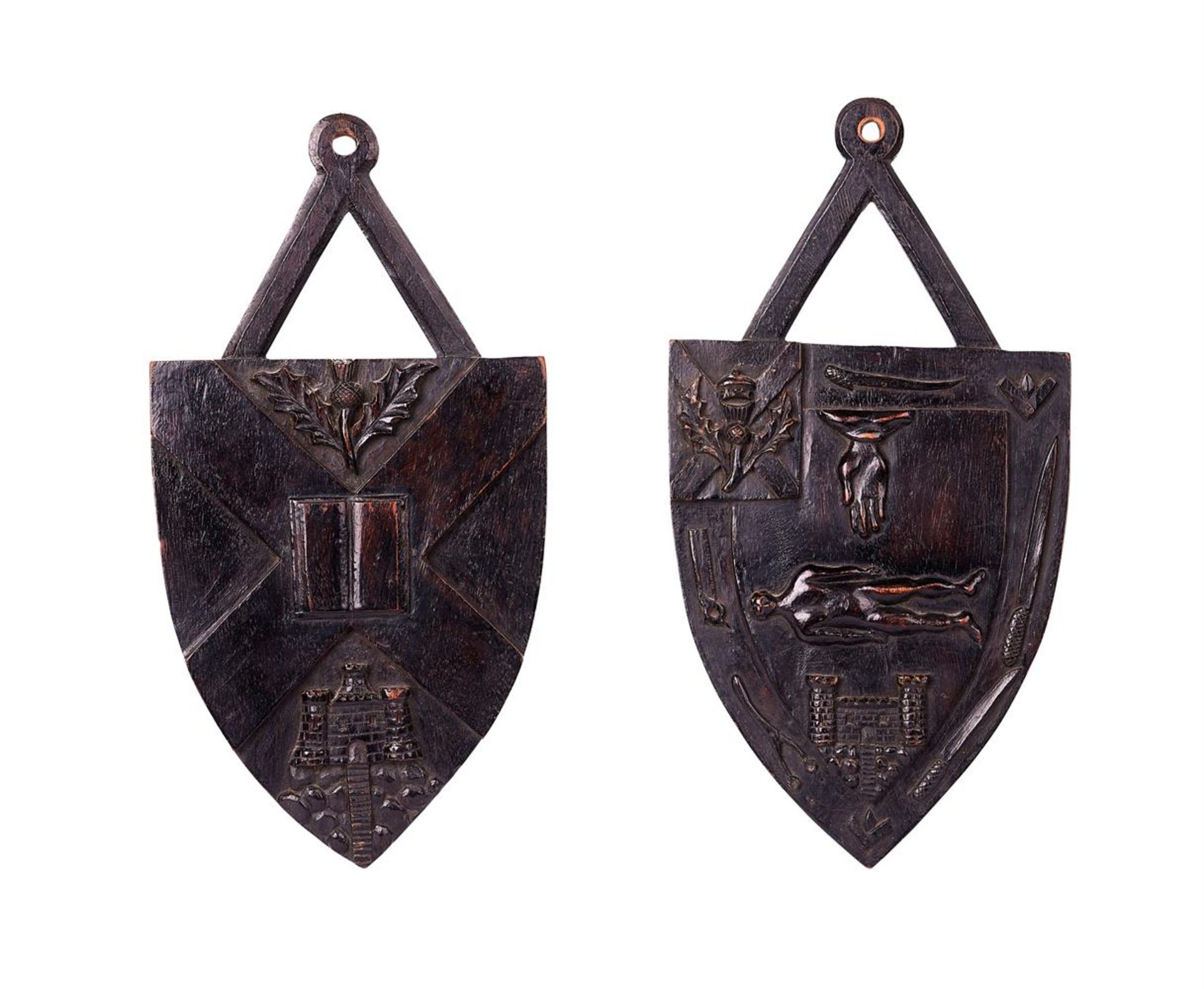 A PAIR OF VICTORIAN CARVED WALNUT SHIELD WALL PLAQUES SCOTTISH, THIRD QUARTER 19TH CENTURY