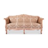 A SWEDISH CARVED, CREAM PAINTED AND DAMASK UPHOLSTERED SOFA, CIRCA 1880