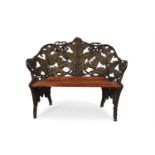 A SMALL CAST IRON GARDEN BENCH IN THE FERN AND BLACKBERRY PATTERN, LATE 19TH CENTURY