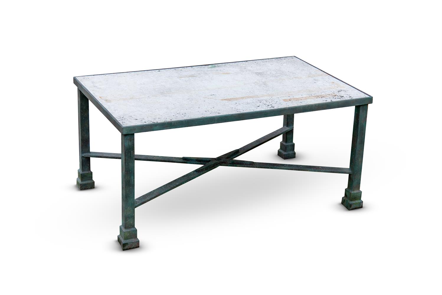 A CAST IRON AND STONE TOP GARDEN TABLE BY KEN BOLAN, MODERN