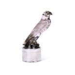 AN ART DECO MAUVE TINTED GLASS FALCON CAR MASCOT BY RENÉ LALIQUE, CIRCA 1925