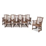 A SET OF EIGHT HARDWOOD 'COCKPEN' OPEN ARMCHAIRS IN GEORGE III STYLE