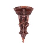 AN ITALIAN CARVED WALNUT WALL BRACKET, 19TH CENTURY