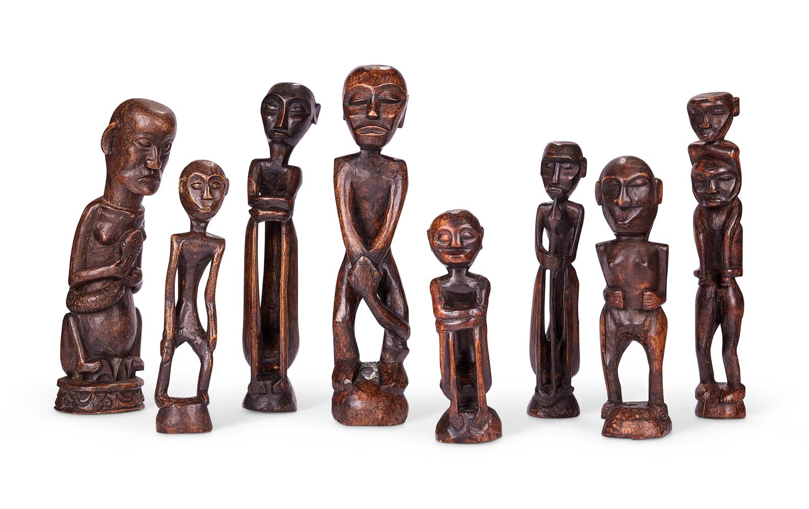 A GROUP OF EIGHT PAPUA NEW GUINEAN CARVED WOOD FIGURES, SEPIK AND SANDAUN PROVINCES