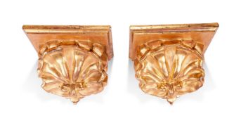 A PAIR OF GILTWOOD AND COMPOSITION SHELL CORBELS IN 18TH CENTURY STYLE