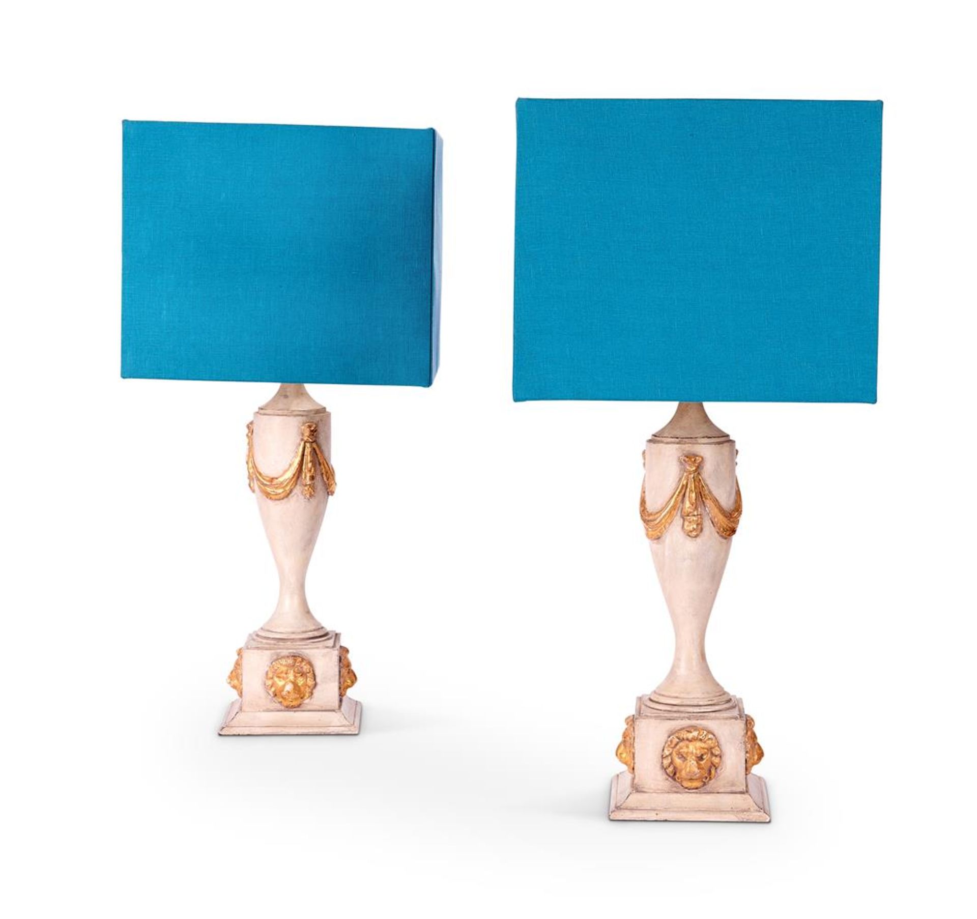 A PAIR OF CREAM PAINTED AND PARCEL GILT LAMPS IN THE NEOCLASSICAL STYLE, CIRCA 1980