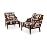 A PAIR OF SIMULATED ROSEWOOD AND UPHOLSTERED BERGERE ARMCHAIRS, CIRCA 1975