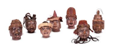 A SET OF SEVEN WOODEN PUPPET HEADS, NORTH INDIAN, 19TH CENTURY