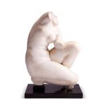 AFTER THE ANTIQUE, A GRAND TOUR WHITE MARBLE FRAGMENT OF THE CROUCHING VENUS, EARLY/MID 19TH CENTURY
