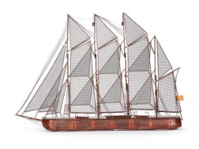 A WALL SCULPTURE OF A BRIG UNDER FULL SAIL BY CURTIS JERÉ, 1975