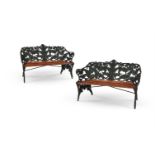 A CLOSE PAIR OF CAST IRON GARDEN BENCHES IN THE FERN AND BLACKBERRY PATTERN, ONE BY J.C.G. BOLINDER