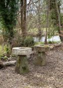 A PAIR OF HEAVY MILL WHEEL TOPPED STADDLE STONE TABLES, LATE 18TH/EARLY 19TH CENTURY