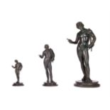 AFTER THE ANTIQUE, A GRADUATED GROUP OF THREE NEAPOLITAN BRONZE FIGURES OF NARCISSUS