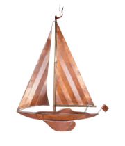 A SHEET COPPER AND BRASS DETAILED WALL SCULPTURE OF A YACHT UNDER FULL SAIL, 1970s