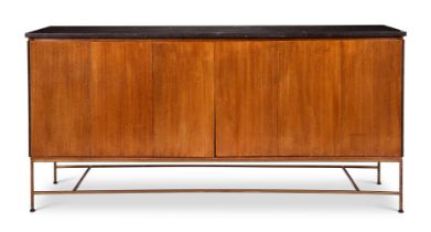 A HARDWOOD AND BRASS SIDE CABINET DESIGNED BY PAUL McCOBB (1917-1969)