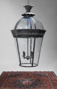 A COPPERED VERDIGRIS METAL AND GLASS LANTERN OF RECENT MANUFACTURE