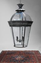 A COPPERED VERDIGRIS METAL AND GLASS LANTERN OF RECENT MANUFACTURE