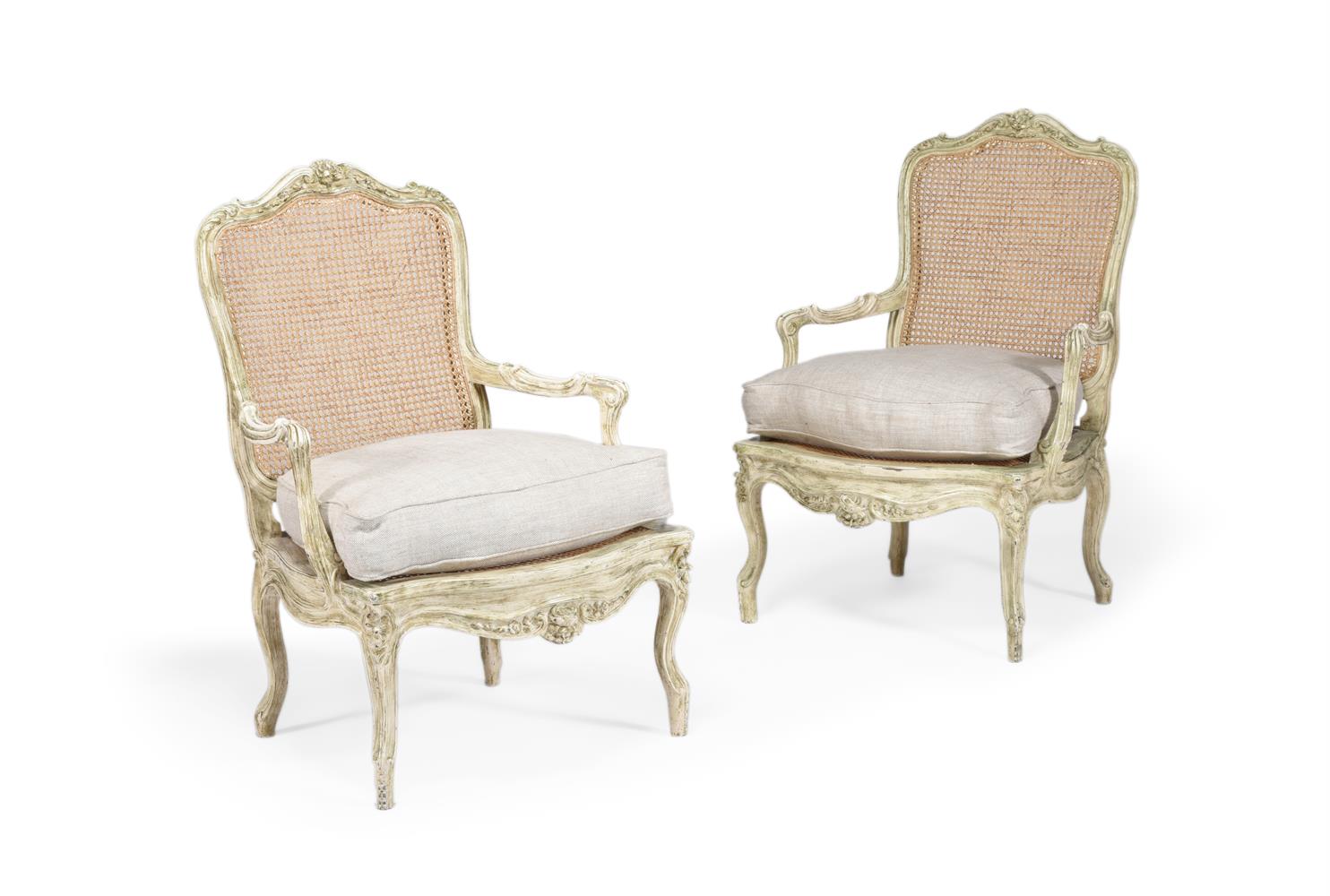 A PAIR OF WHITE PAINTED AND CANEWORK ARMCHAIRS, IN LOUIS XV STYLE