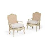 A PAIR OF WHITE PAINTED AND CANEWORK ARMCHAIRS, IN LOUIS XV STYLE