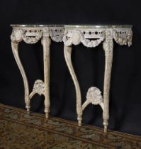 A PAIR OF CARVED AND CREAM PAINTED CONSOLE TABLESIN GEORGE III STYLE, LATE 19TH OR 20TH CENTURY