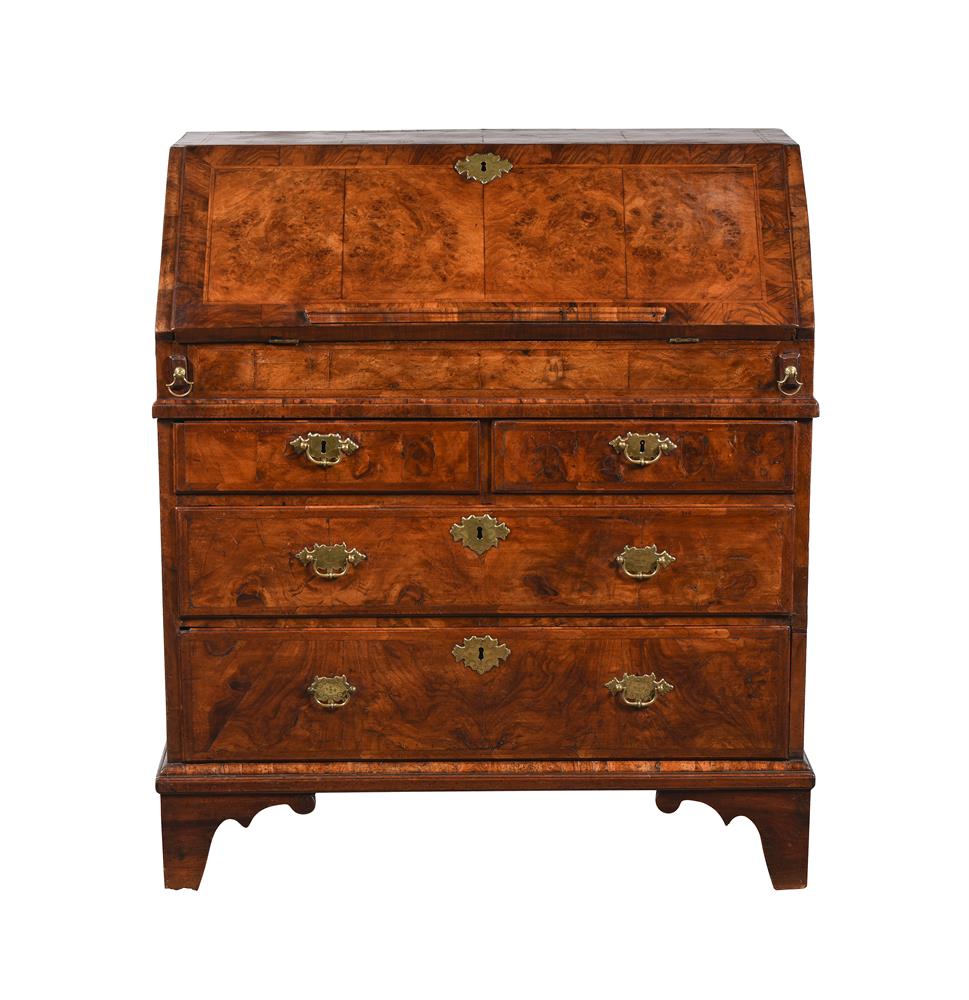 A GEORGE II WALNUT, BURR WALNUT, CROSSBANDED AND FEATHER BANDED BUREAU, CIRCA 1750