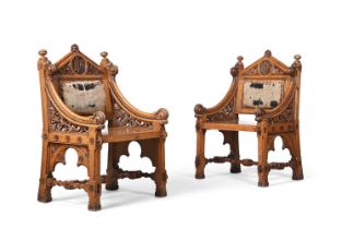A PAIR OF VICTORIAN GOTHIC REVIVAL CARVED OAK THRONE CHAIRS, IN ECCLESIASTICAL TASTE