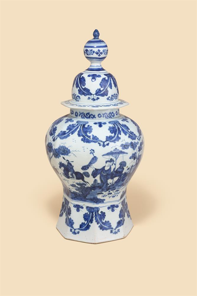 A DUTCH DELFT BLUE AND WHITE OCTAGONAL SECTION BALUSTER VASE AND COVER, CIRCA 1700