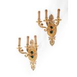 A PAIR OF ITALIAN GILT METAL WALL APPLIQUES