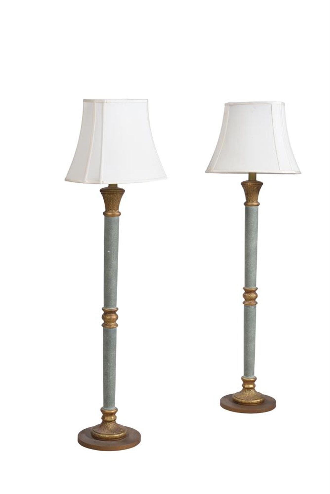 A PAIR OF GREEN AND GILT COMPOSITION STANDARD LAMPS