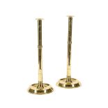 A PAIR OF POLISHED BRASS EJECTOR CANDLESTICKS SECOND HALF 19TH CENTURY