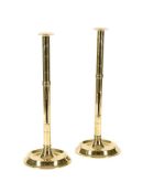 A PAIR OF POLISHED BRASS EJECTOR CANDLESTICKS SECOND HALF 19TH CENTURY