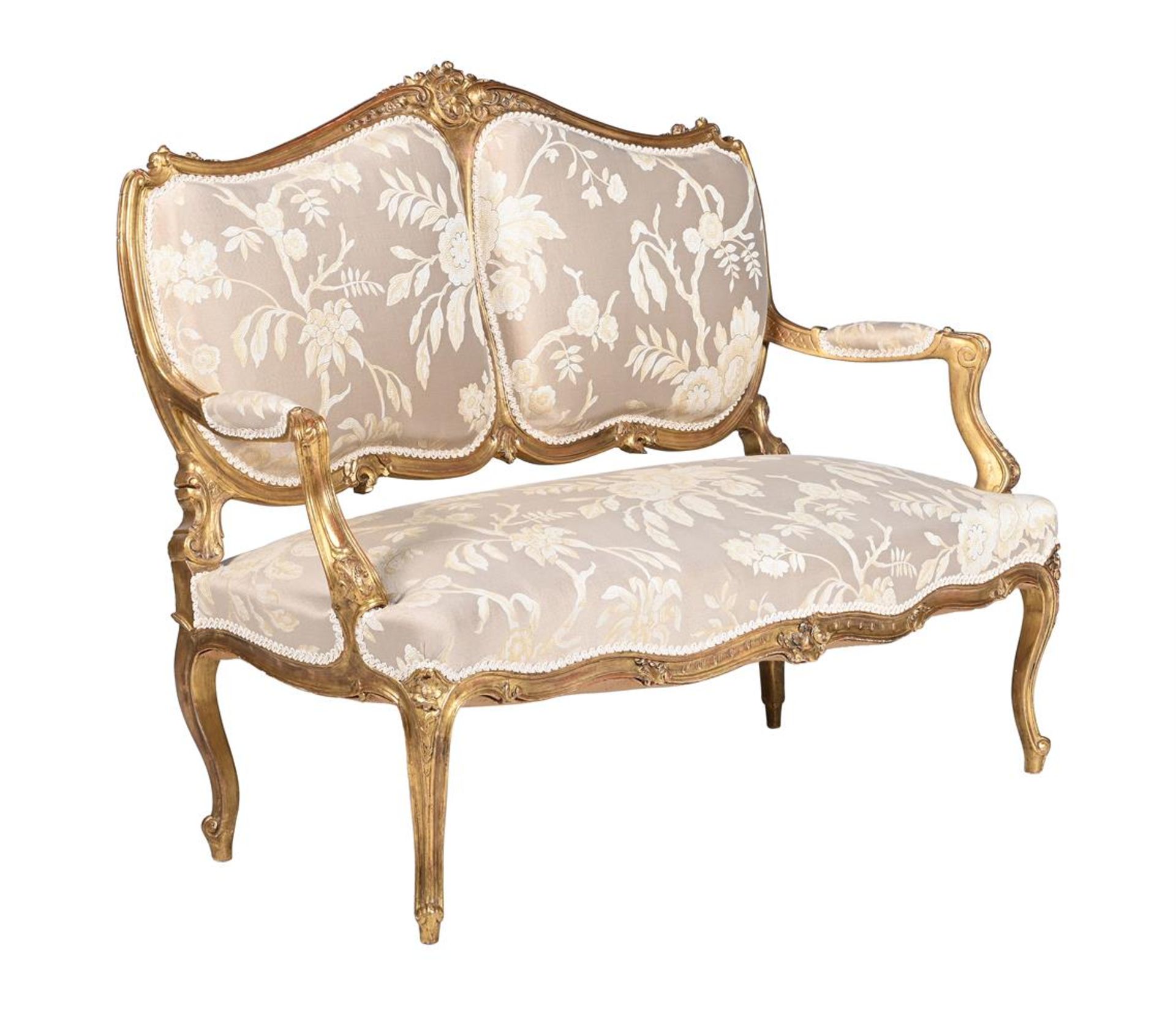 A CARVED GILTWOOD AND UPHOLSTERED CANAPE IN LOUIS XV STYLE