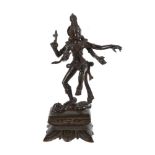 AN INDIAN PATINATED METAL FIGURE OF SHIVA