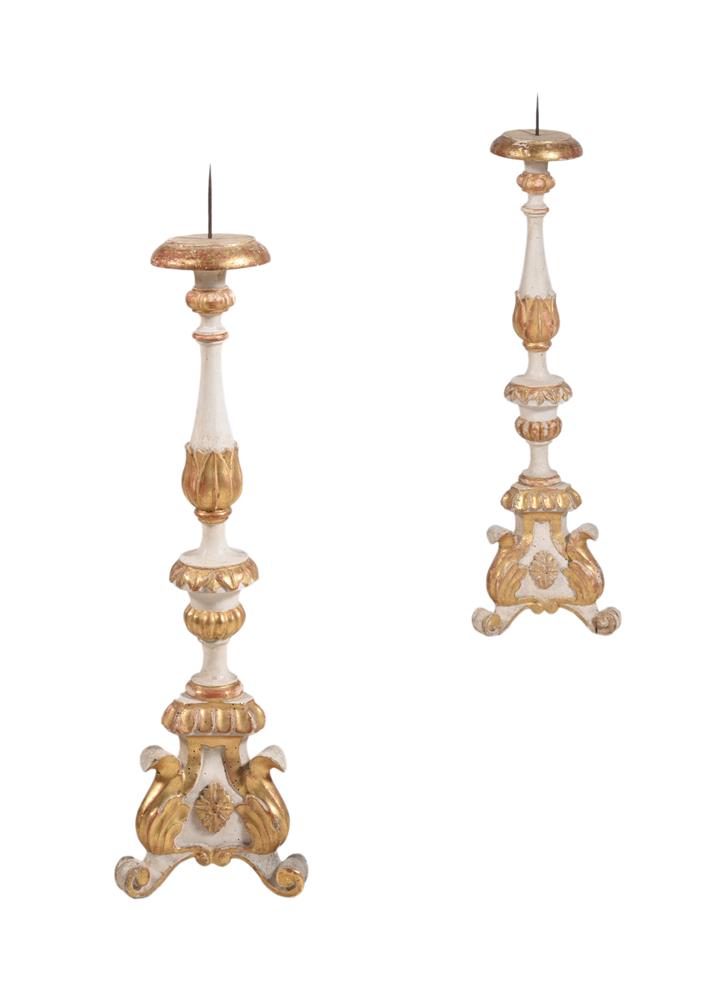 A PAIR OF GREY PAINTED AND PARCEL GILT PRICKET CANDLESTICKS