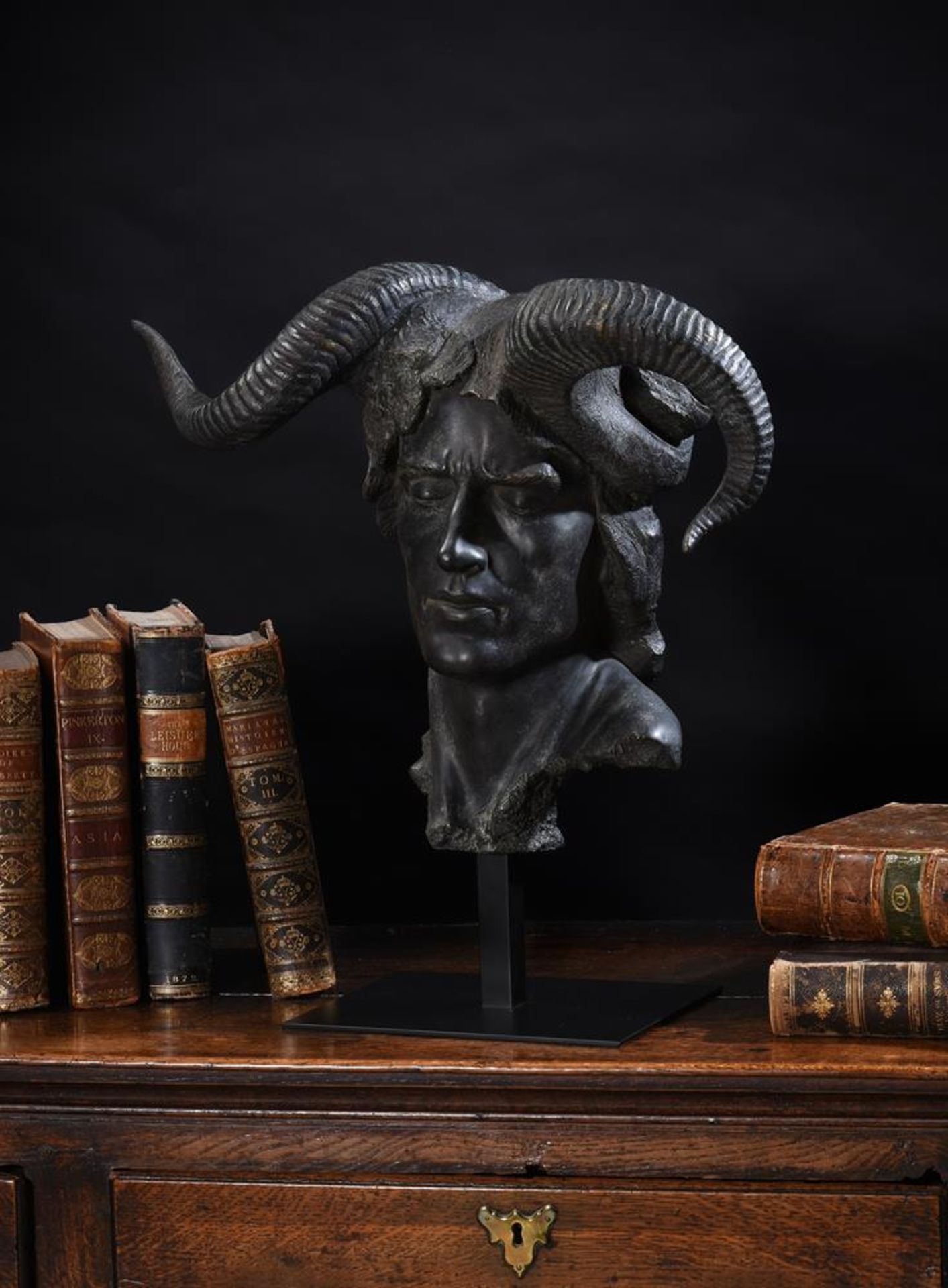 A BRONZED RESIN MODEL OF THE BUST OF A DEVIL OR 'DAMIEN'