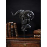 A BRONZED RESIN MODEL OF THE BUST OF A DEVIL OR 'DAMIEN'
