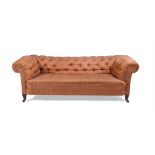 A LATE VICTORIAN MAHOGANY AND BUTTON UPHOLSTERED SOFA OF CHESTERFIELD TYPE, LATE 19TH CENTURY