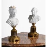 A PAIR OF FRENCH SEVRES STYLE BUSCUIT PORCELAIN BUSTS OF LOUIS XVI AND MARIE ANTOINETTE