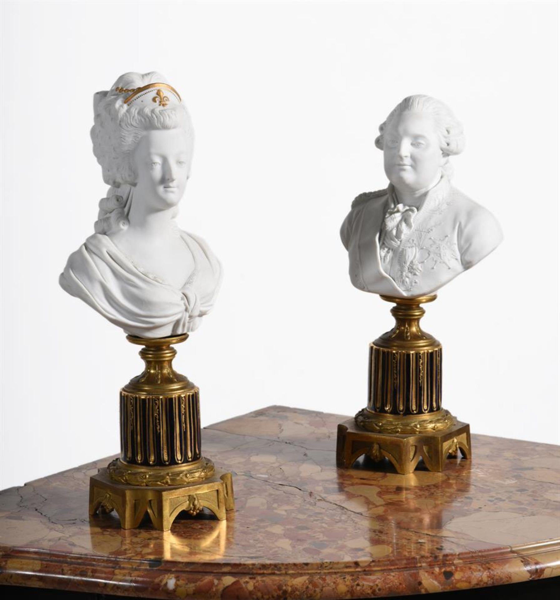 A PAIR OF FRENCH SEVRES STYLE BUSCUIT PORCELAIN BUSTS OF LOUIS XVI AND MARIE ANTOINETTE