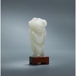 A Chinese white jade figure of a boy
