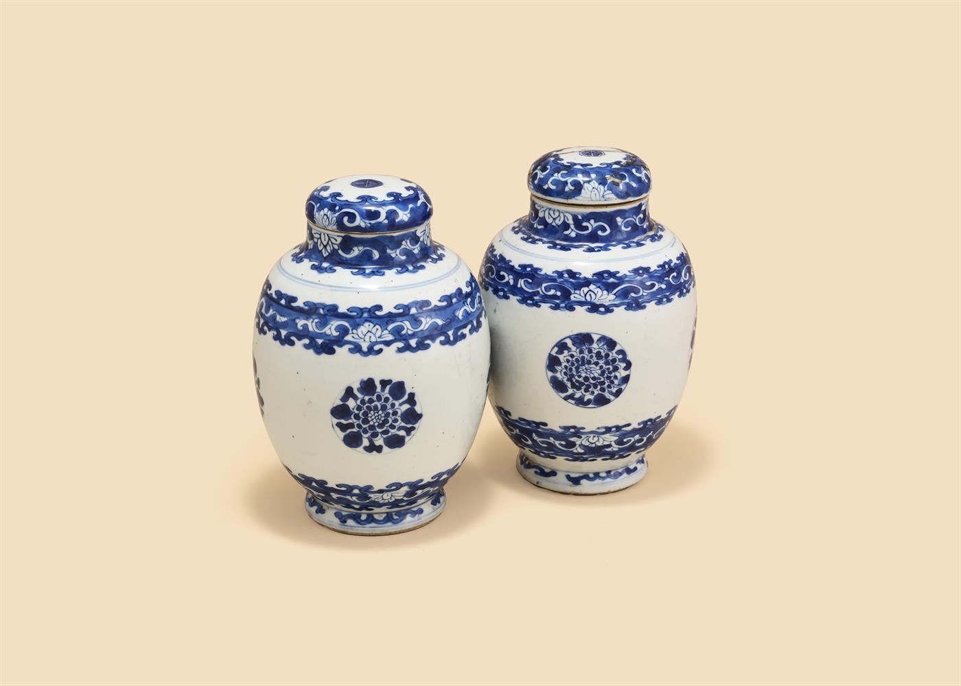 A pair of Chinese blue and white vases and covers