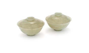 A pair of celadon jadeite bowls and covers