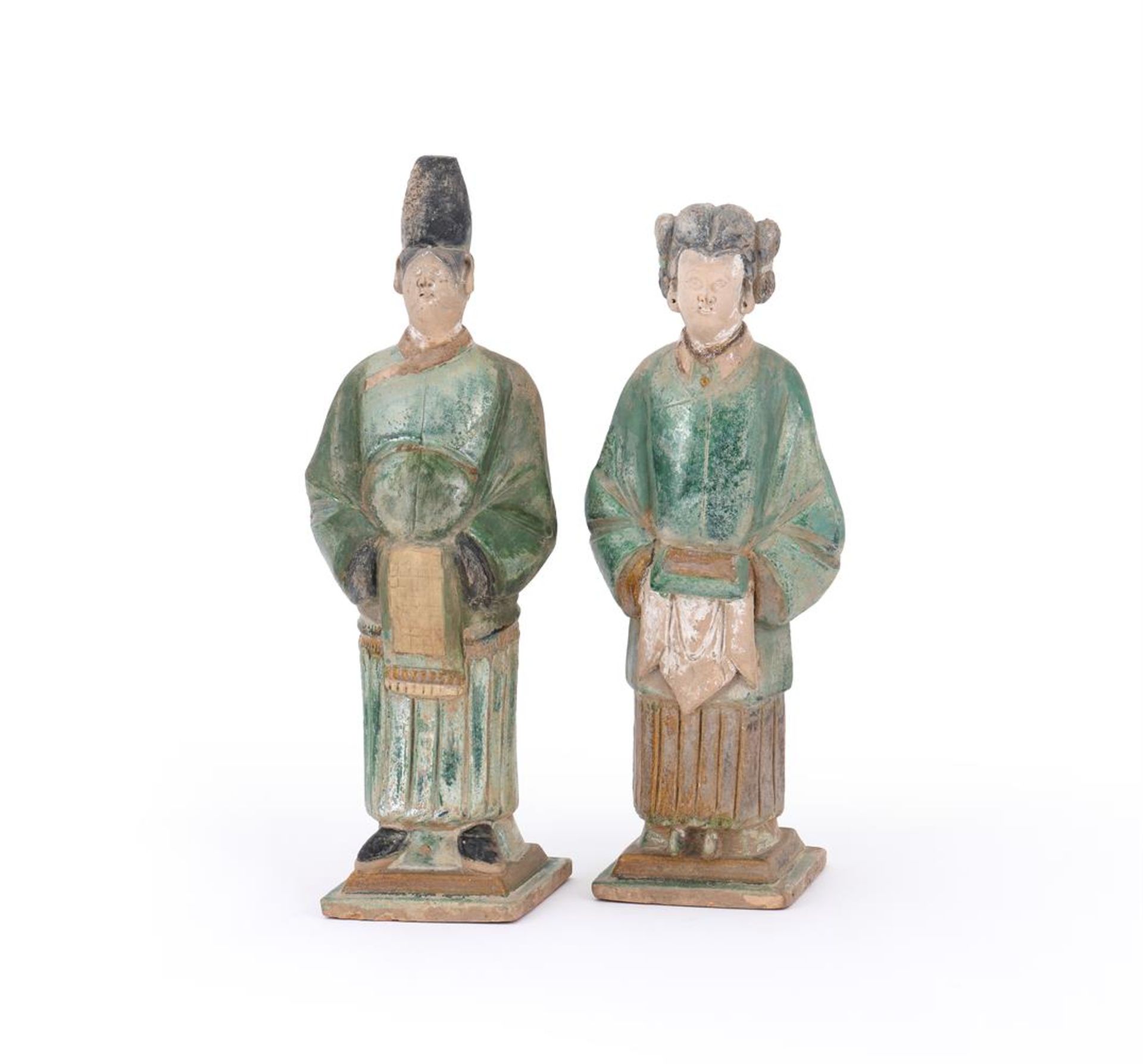 A pair of Chinese pottery amber and green glazed tile-maker's figures