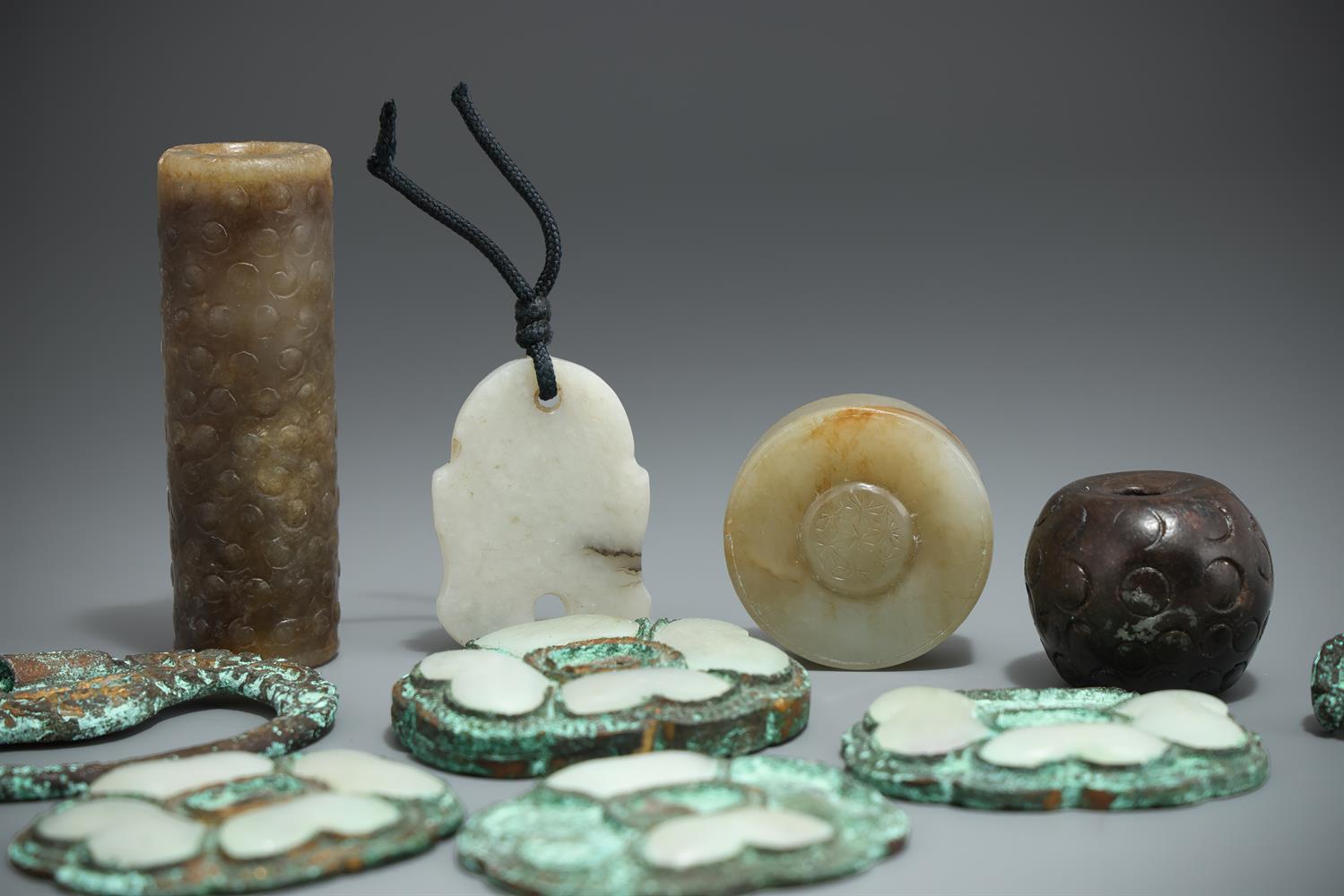 A Chinese celadon and brown jade cylindrical toggle - Image 2 of 4