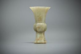 A Chinese celadon jade archaistic gu vase